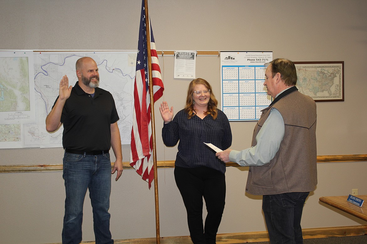 Shawn Smalley took the oath of office for Commissioner of Mineral County while Jamie Talbot was sworn in for another term as the Clerk of Recorder by Commissioner Roman Zylawy last Friday afternoon.