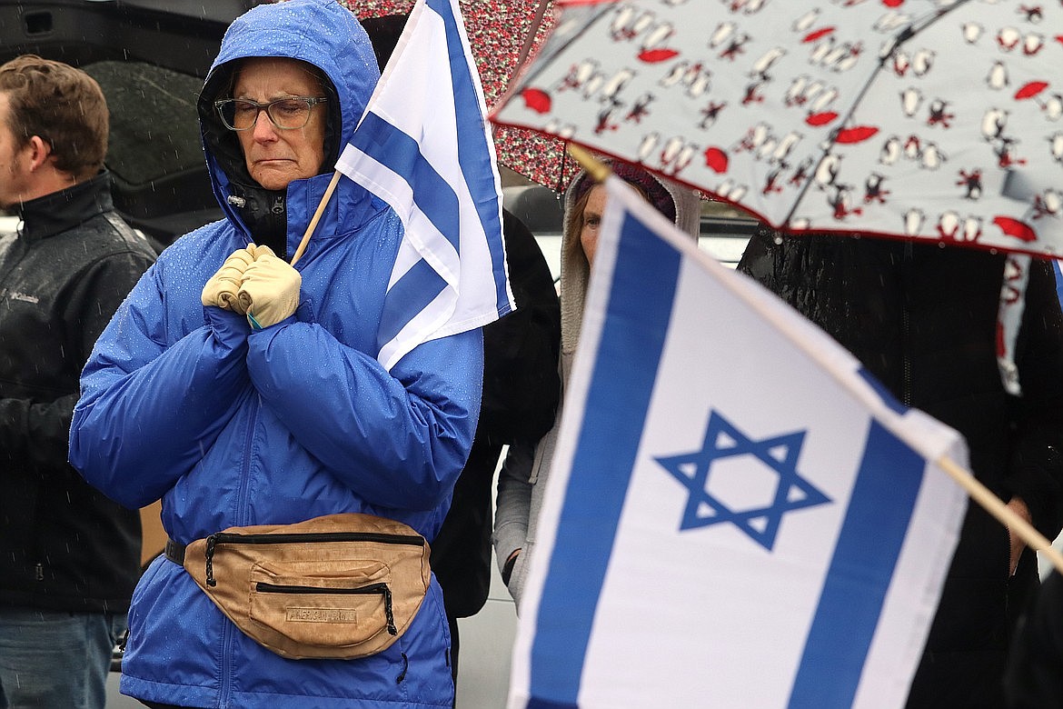 Cindy Hirsch prays during a rally in Coeur d'Alene in support of Israel.