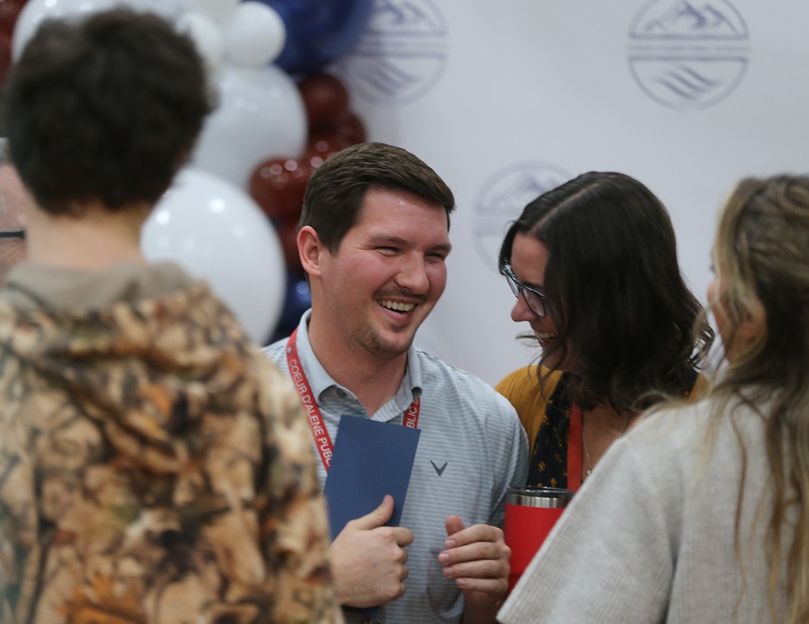 Lakes Middle School math teacher Marcus Ross smiles as he is celebrated by his colleagues Nov. 20 after receiving a Milken Educator Award and a $25,000 cash prize. The surprise announcement was made during a school assembly attended by district, municipal and state dignitaries.