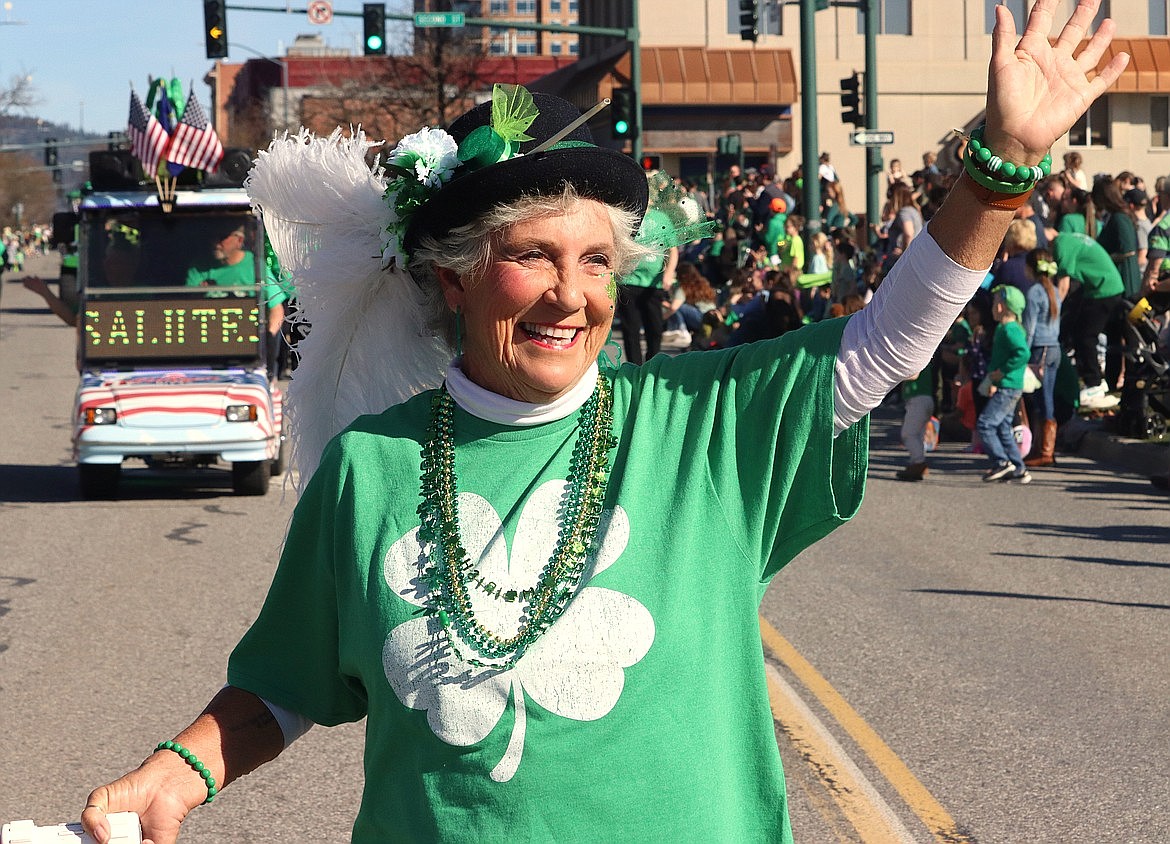 Mary Reno with the Blazen Divaz smiles and waves during the St. Patrick's Day Parade in Coeur d'Alene.