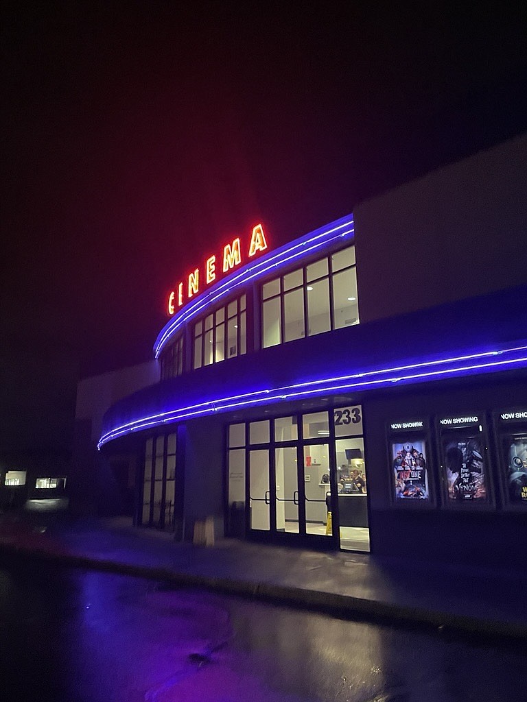 A drizzly night highlights the neon at Fairchild Cinemas in Moses Lake. This week will have a bit of snow and rain to start the new year.
