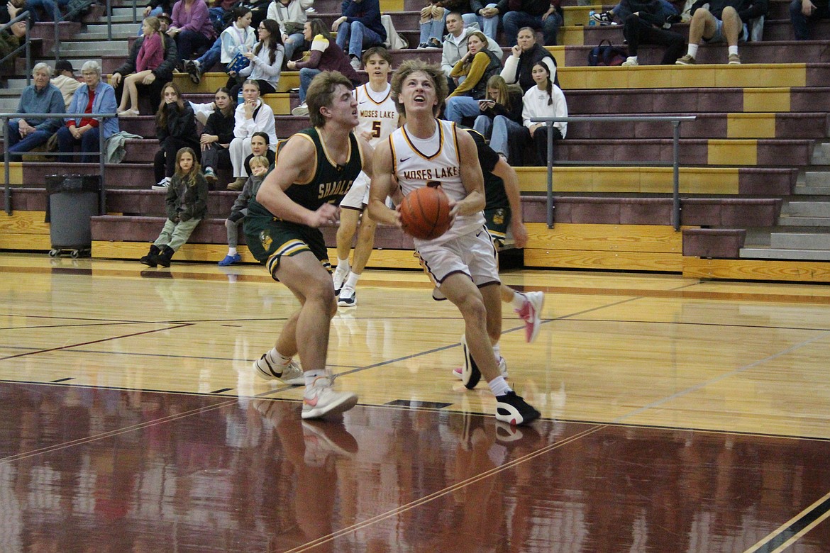 Moses Lake junior Brady Jay, right, led the Mavericks with 20 points in Monday’s win over Shadle Park.