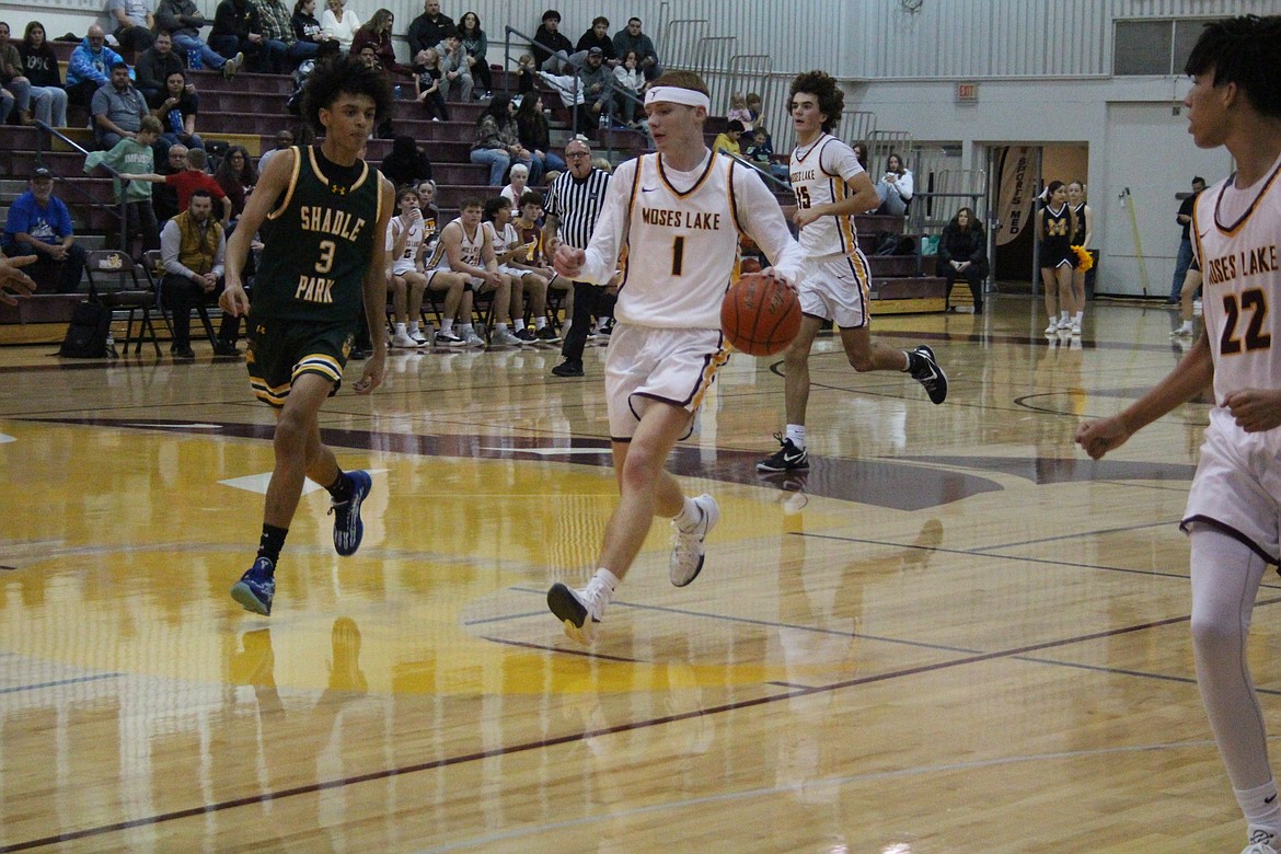 Moses Lake junior Kyre Wiltbank (1) brings the ball up the floor against Shadle Park on Monday.