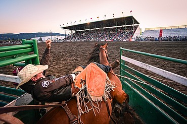 Jess Pope busts out of the chute on his horse Here I Am during bareback riding at the PRCA Rodeo during the Northwest Montana Fair & Rodeo on Friday, Aug. 16. (Casey Kreider/Daily Inter Lake)