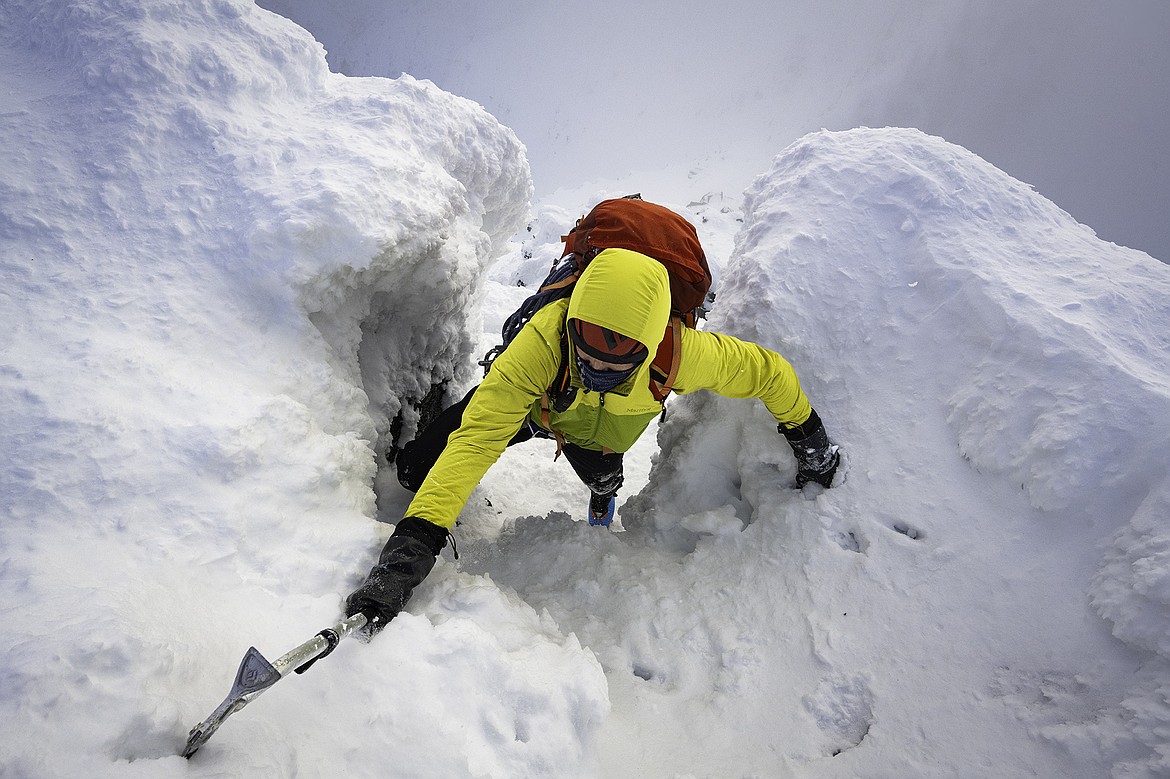 Adam Clark ascends a rime chimney while attempting the West Ridge of Gunsight Mountain. Seth Anderson Photo.