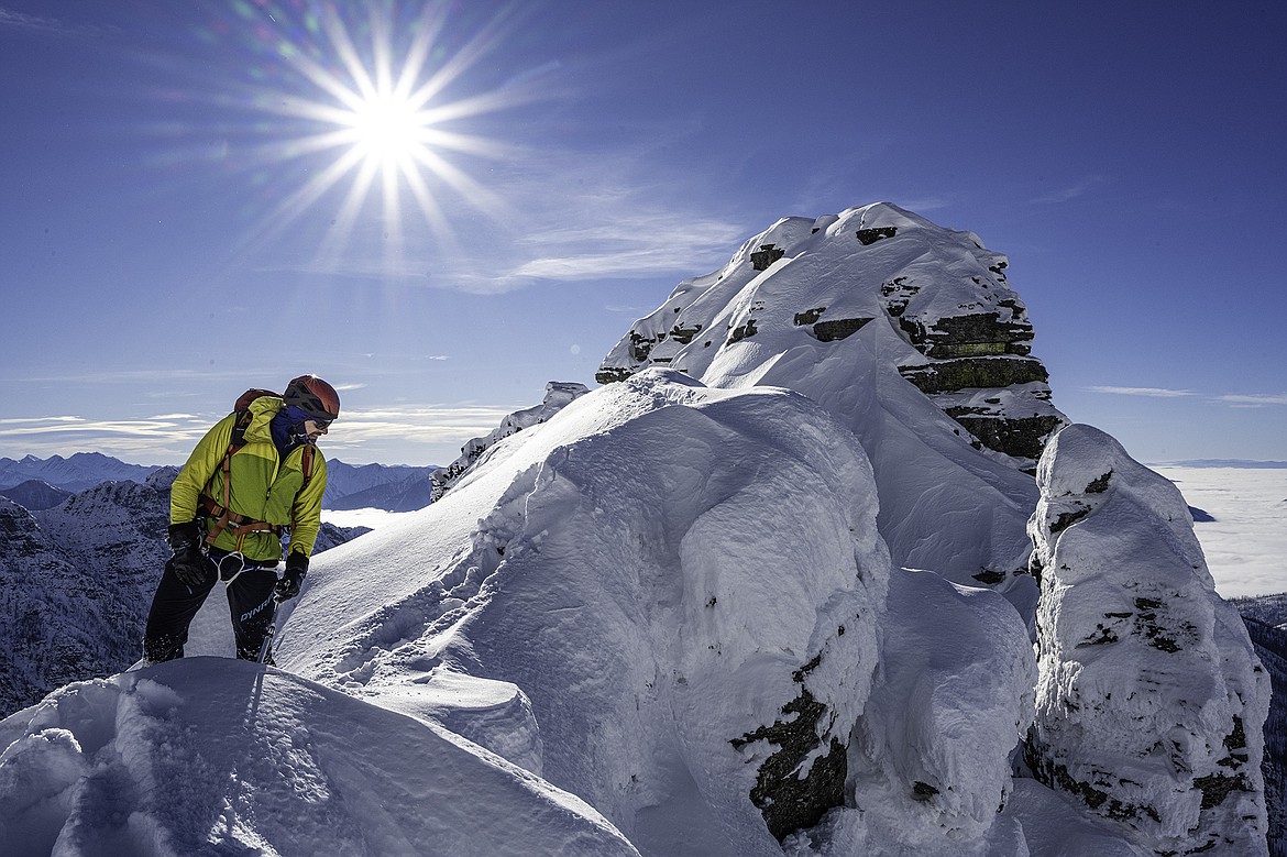 Adam Clark reaches the ridge crest on Gunsight Mountain. Seth Anderson Photography.
