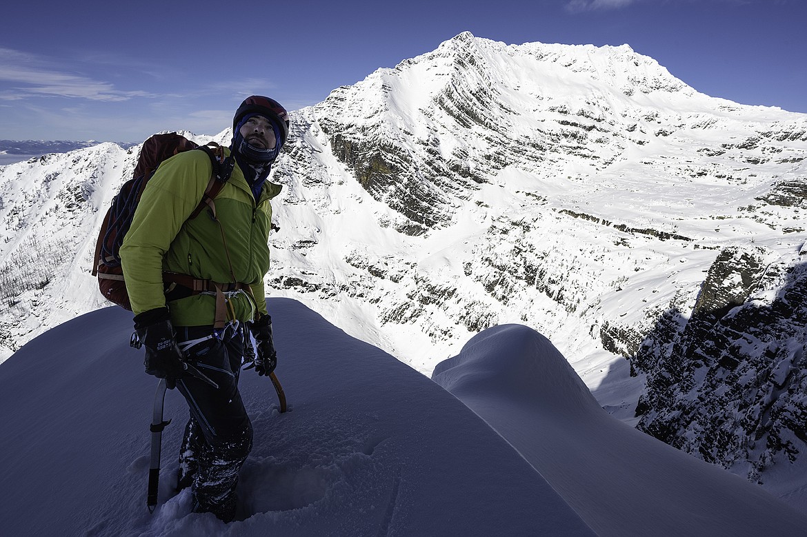 Adam Clark and Edwards Mountain during an attempt on the West Ridge of Gunsight Mountain. Seth Anderson Photo.