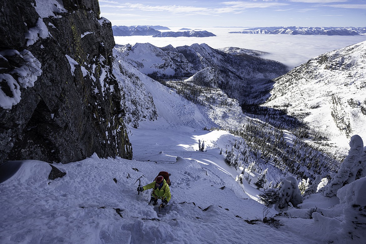Adam Clark scrambles a short mixed step above the Sperry Chalet to access the West Ridge of Gunsight. Seth Anderson Photo.