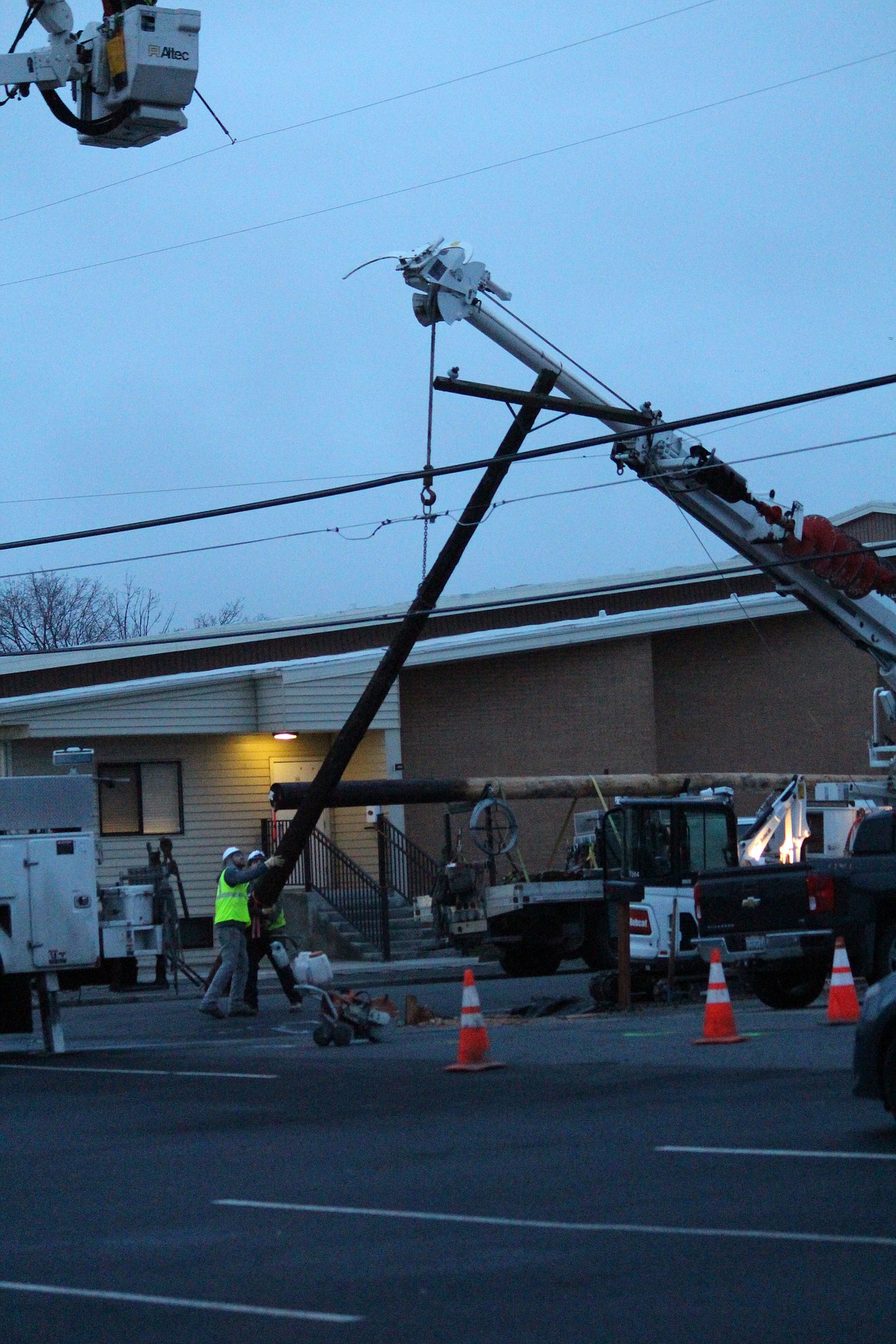 A broken power pole is removed on Gumwood Street in Moses Lake.