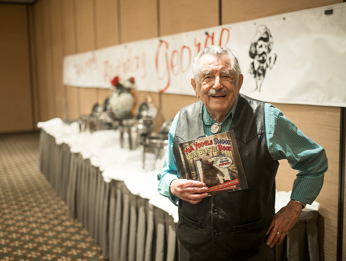 George Ostrom with his children’s book in 2018. (Chris Peterson/Hungry Horse News FILE)