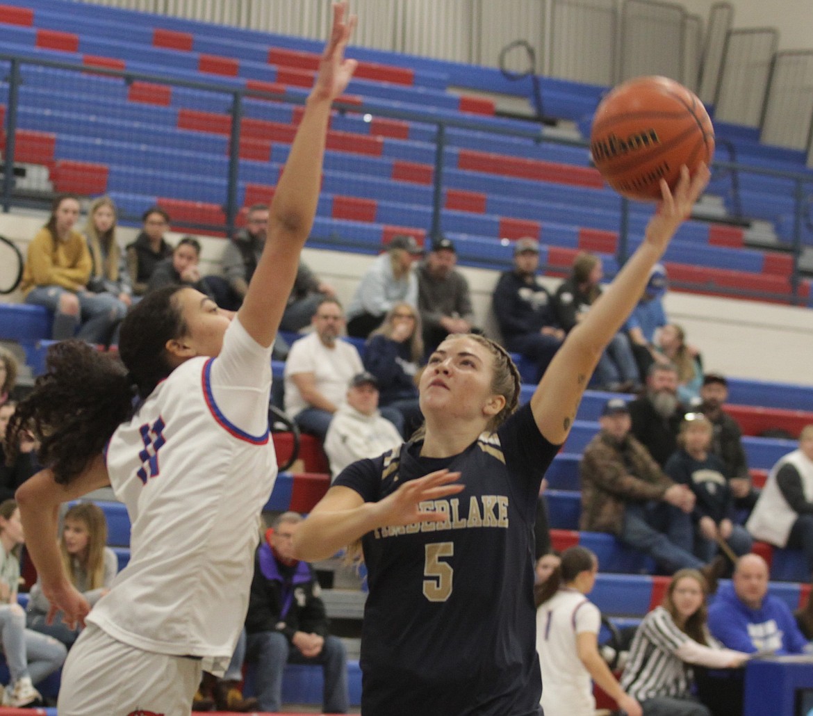 JASON ELLIOTT/Press
Timberlake senior guard Jozee MacArthur attempts to shoot over Coeur d'Alene's Brookeslee Colvin during the first half of Friday's game at Viking Court.