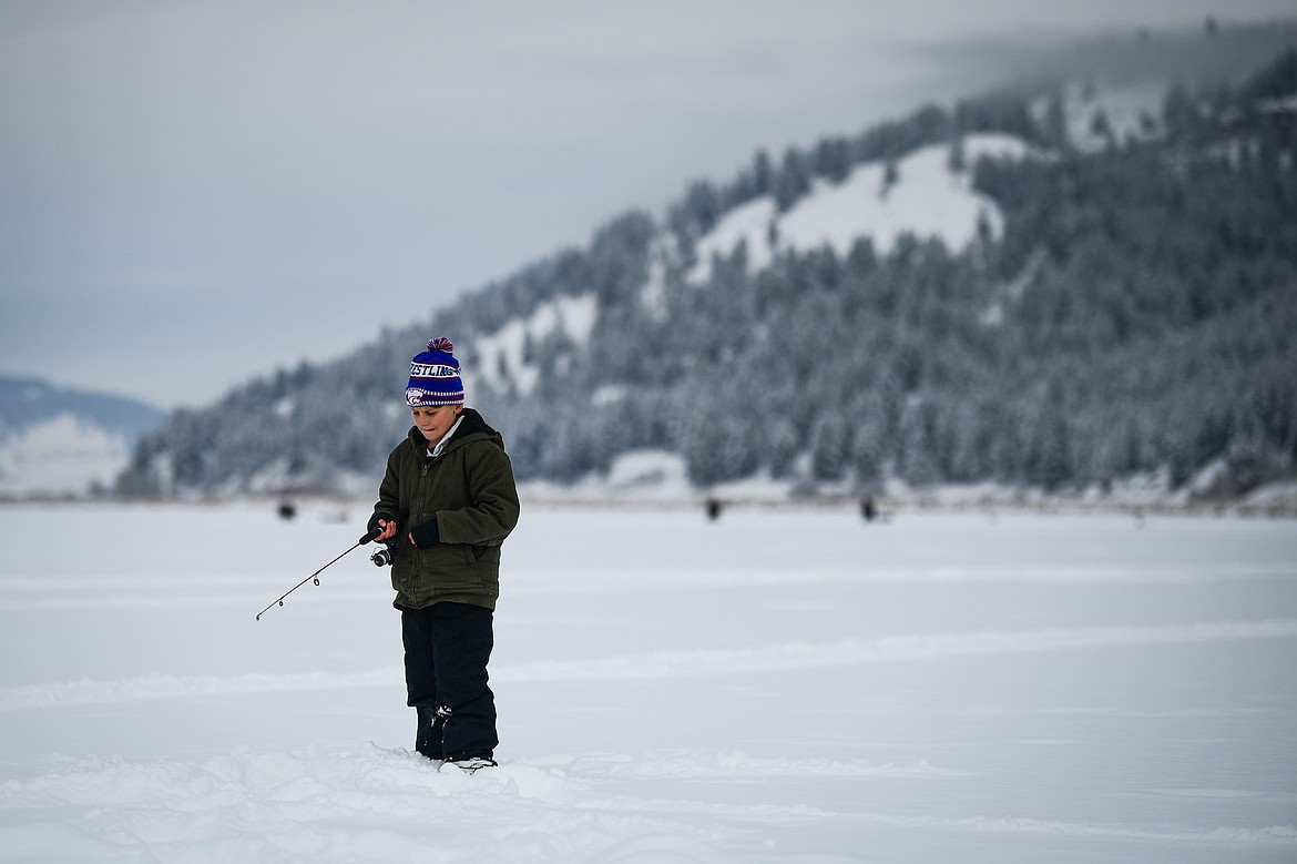 Darin Weaver waits for a fish to bite at the 53rd annual Sunriser Lions Ice Fishing Derby on Smith Lake in Kila on Saturday, Jan. 4. (Casey Kreider/Daily Inter Lake)