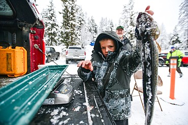 Garin Hicks holds a northern pike he caught that weighed in at 2.97 pounds at the 53rd annual Sunriser Lions Ice Fishing Derby on Smith Lake in Kila on Saturday, Jan. 4. (Casey Kreider/Daily Inter Lake)
