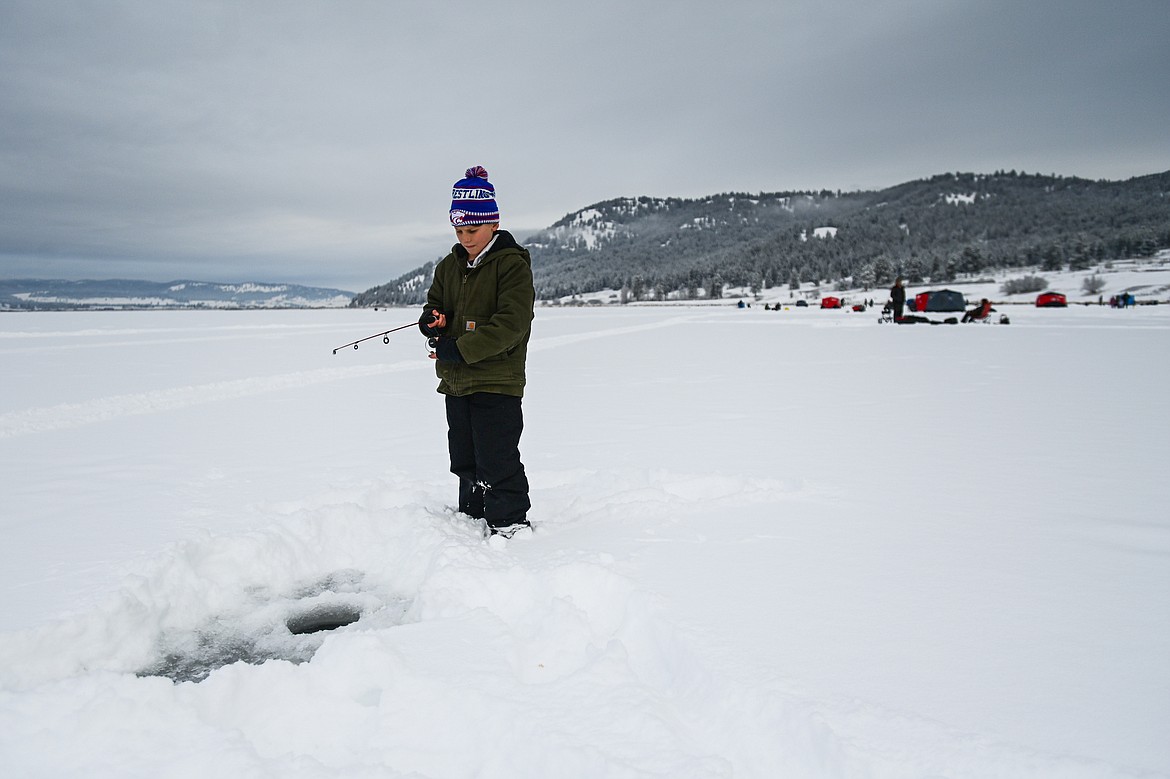 Darin Weaver waits for a fish to bite at the 53rd annual Sunriser Lions Ice Fishing Derby on Smith Lake in Kila on Saturday, Jan. 4. (Casey Kreider/Daily Inter Lake)