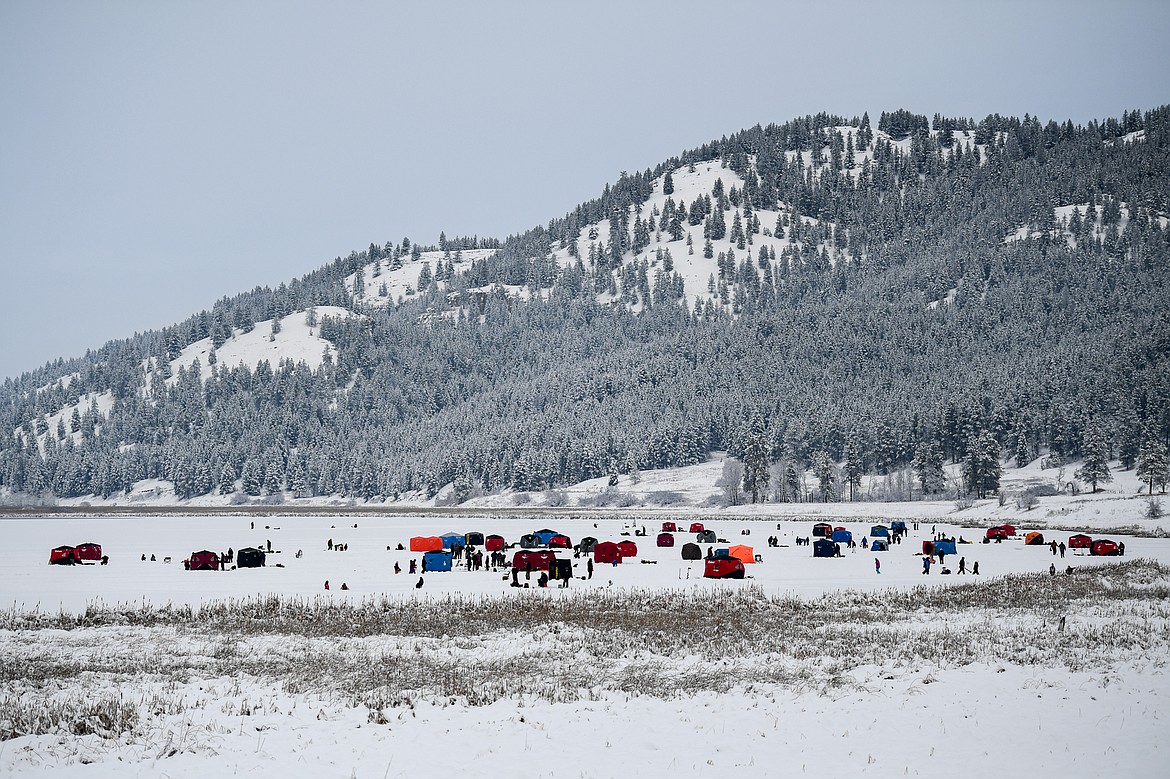 Ice fishing tents are spread out across the frozen surface of Smith Lake at the 53rd annual Sunriser Lions Ice Fishing Derby in Kila on Saturday, Jan. 4. (Casey Kreider/Daily Inter Lake)