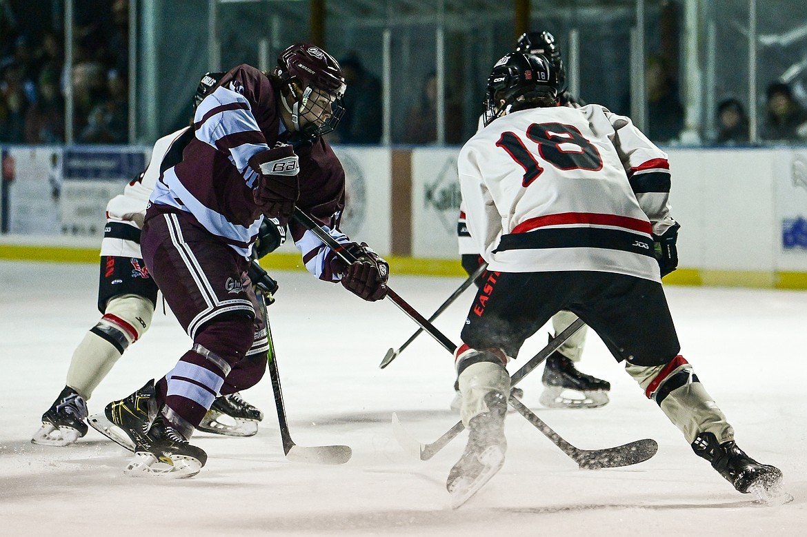 Griz forward Jesse Belley (18) pushes the puck into the Eastern Washington zone during the Winter Classic at Woodland Park Ice Rink in Kalispell on Saturday, Jan. 4. (Casey Kreider/Daily Inter Lake)