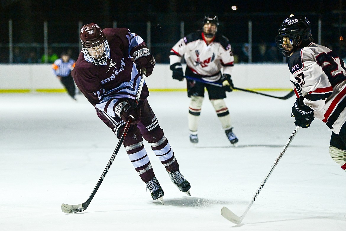 Griz forward Jackson Knutsen (22) shoots in the first period against Eastern Washington during the Winter Classic at Woodland Park Ice Rink in Kalispell on Saturday, Jan. 4. (Casey Kreider/Daily Inter Lake)