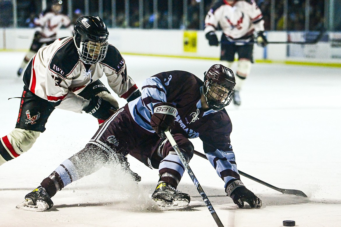 Griz forward Max Toijala (3) pushes the puck into the Eastern Washington zone in the first period of the Winter Classic at Woodland Park Ice Rink in Kalispell on Saturday, Jan. 4. (Casey Kreider/Daily Inter Lake)