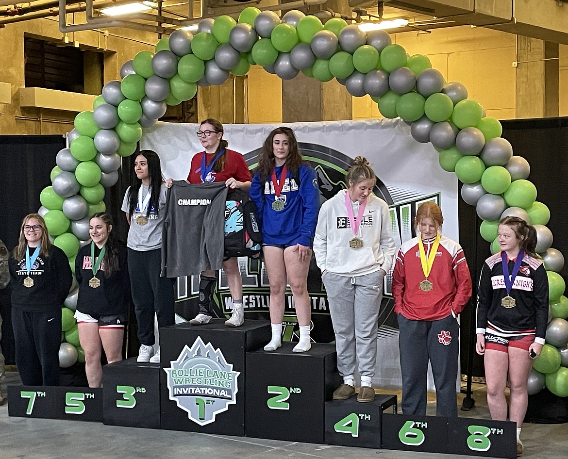 Sandpoint's Sylvia Becker, second from left, is all smiles after placing fifth in the girls 165-pound bracket.