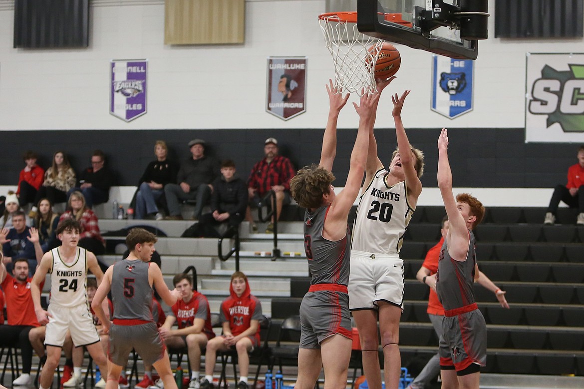 Royal sophomore Manny Ruvalcaba (23) passes the ball to a teammate in the corner of the court. Ruvalcaba’s 11 points were the most off the bench in the win.