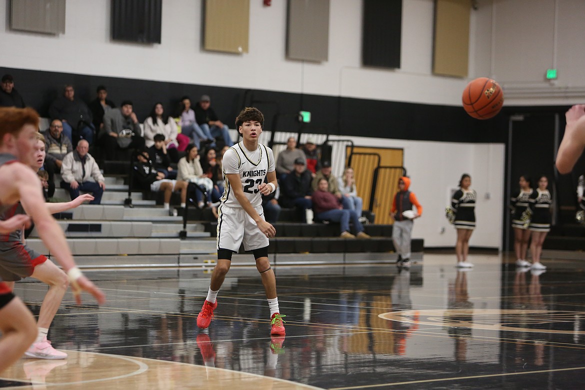 Royal senior Trent Jensen (20) rises up to lay the ball in for Royal’s first basket of the game during Friday’s matchup against Riverside.