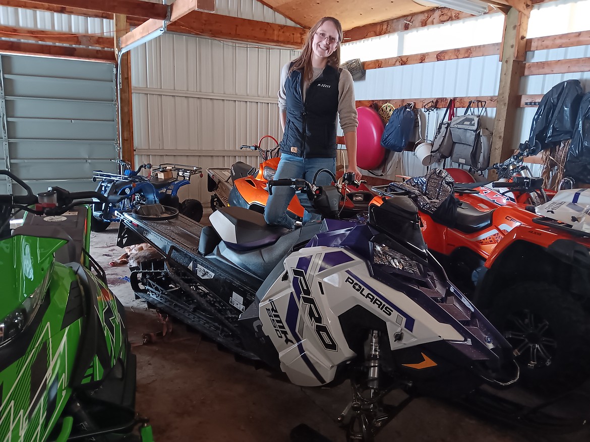 Brogan Keenen, manager of the $50,000 Bar in Haugan, explains the different types of snowmobiles for the different needs of people from their family toy-shed. The upcoming Winterfest 2025 and $1,000 Super Poker Ride this month will be headquartered at the $50,000 Bar.