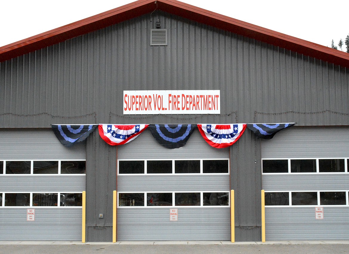 The Superior Volunteer Fire Department had the Town of Superior Public works employees hang a display of banners in honor of Steve Temple, the former fire chief, who recently died. (Mineral Independent/Amy Quinlivan)