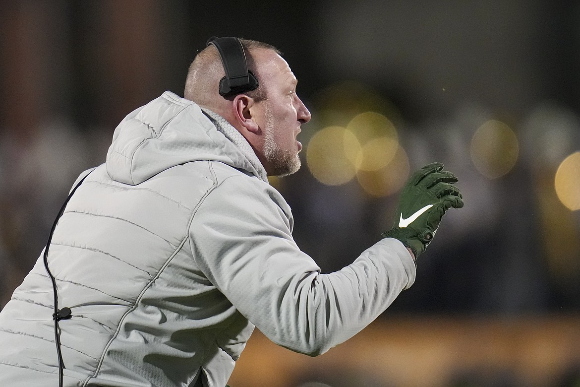 North Dakota State head coach Tim Polasek talks to his team during the first half of the FCS Championship NCAA college football game against Montana State, Monday, Jan. 6, 2025, in Frisco, Texas. (AP Photo/Julio Cortez)