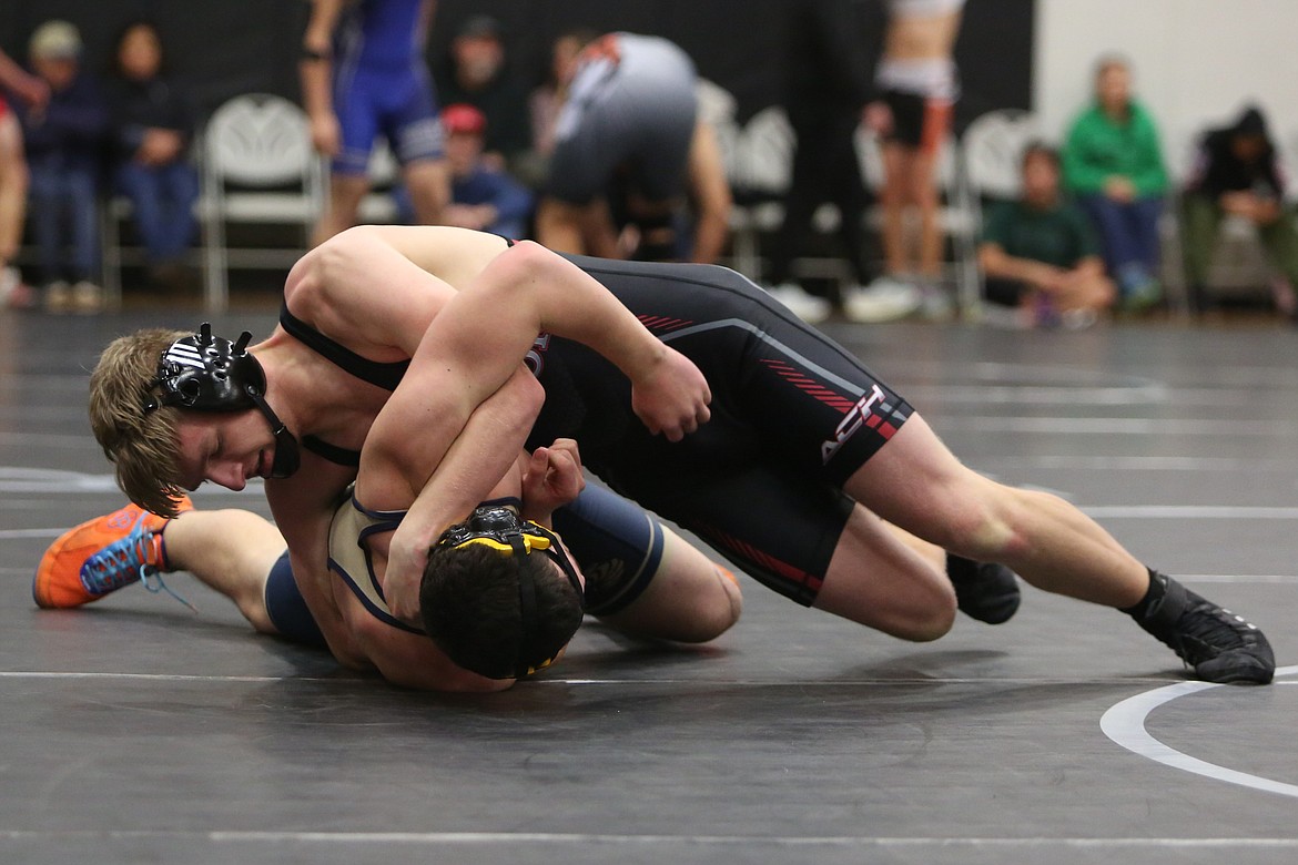 Almira/Coulee-Hartline’s Evan Tipps, top, works to flip his opponent on their back during Saturday’s Banks Lake Brawl in Coulee City.