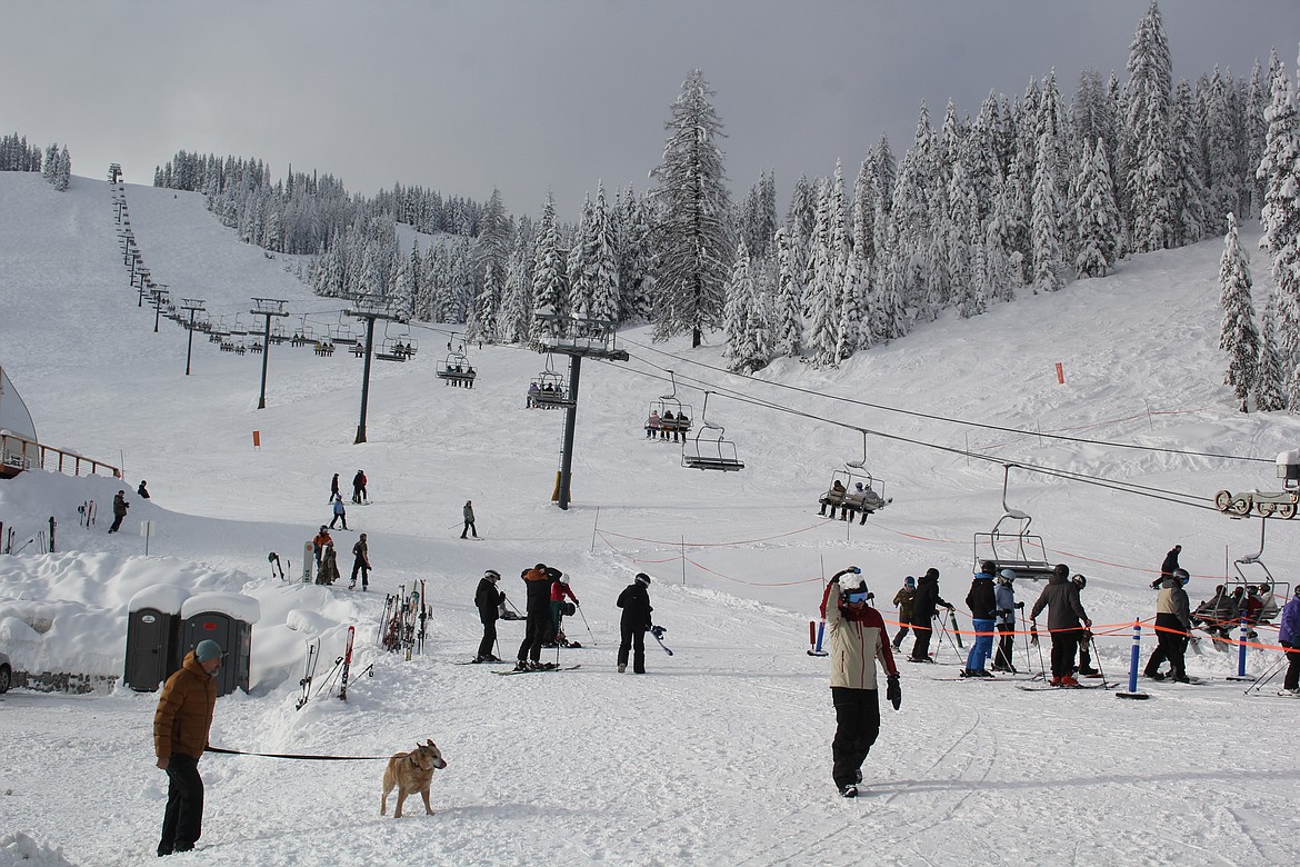 Lookout Pass Ski Aera had plenty of snow on New Year's Eve with the Peak 1 quad chair lift packed, but with short lines. The ski area has a 50-inch settled base at the summit. (Monte Turner/Mineral Independent)