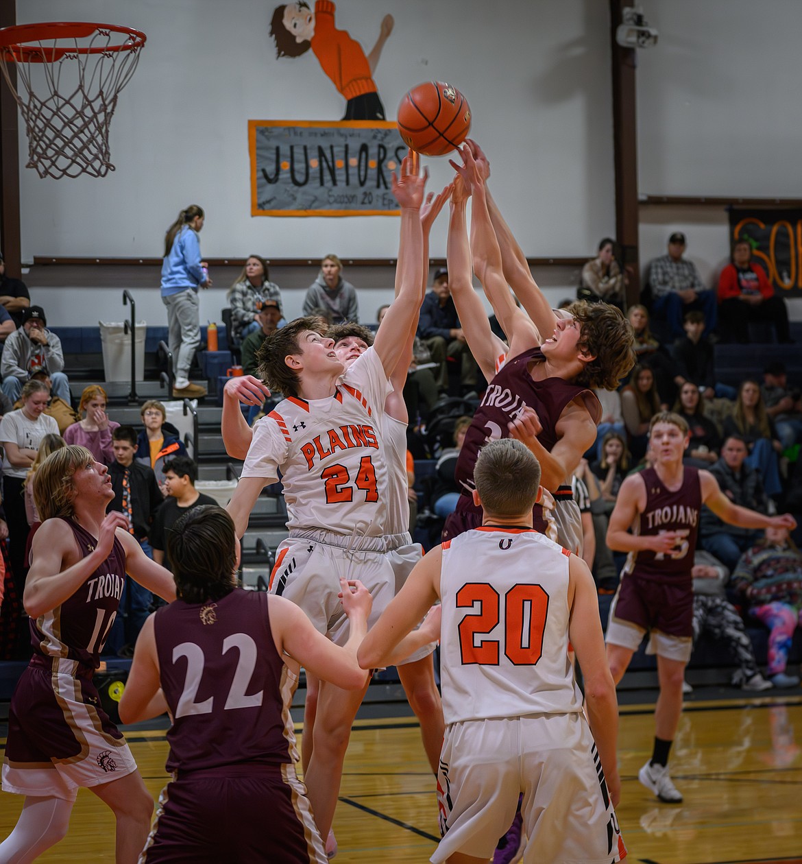 Horsemen sophomore forward Cooper Meredith (24) goes high in a battle for a rebound versus Troy during their game this past Thursday in Plains.  (Photo by Tracy Scott)