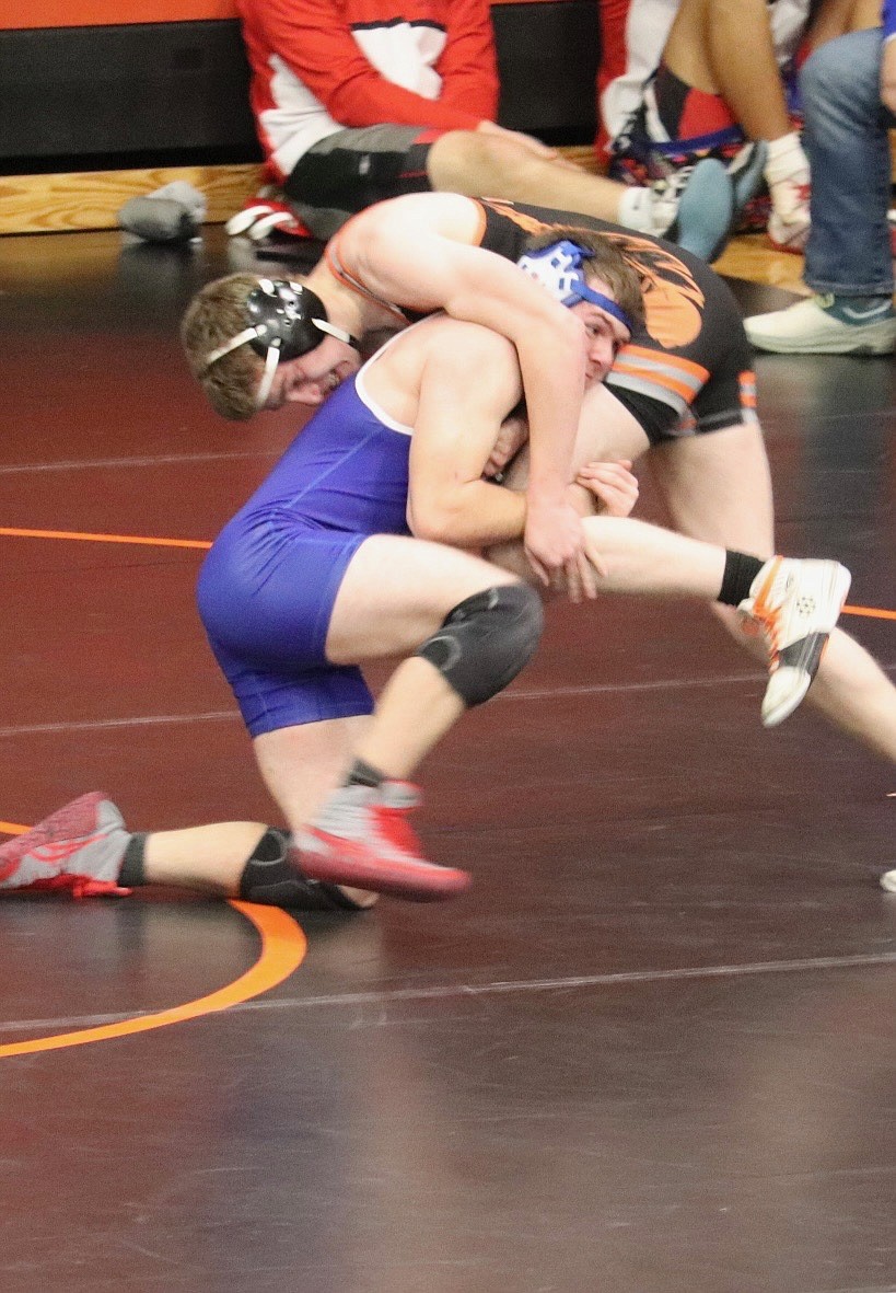 Superior 150 pounder Sam Doughty (blue uniform) gets control of an opponent at this past weekends Western Montana Invitational (Ronan Duals) in Ronan.  (Photo by Kami Milender.