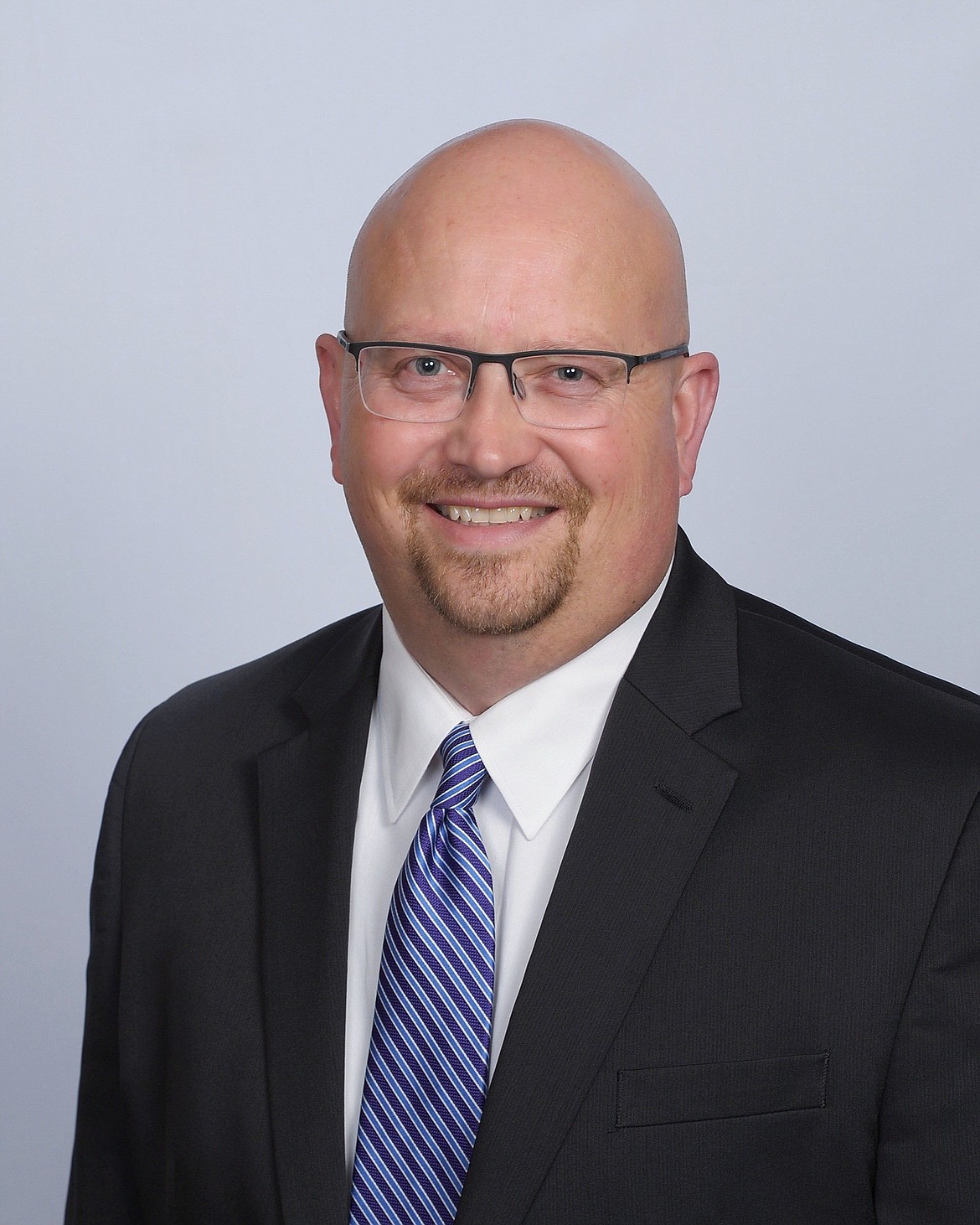 Charlie Clark has been reappointed to head the state Department of Financial Institutions.