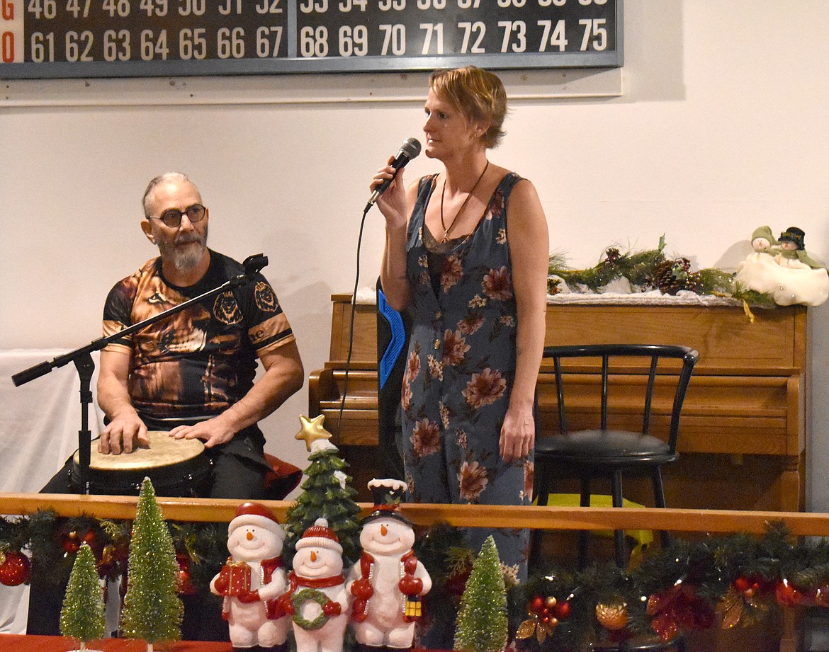 Kate Buchanan, right, sings at Soap Lake Open Mic Night, accompanied by a background recording and drummer David Agliano. Buchanan started Open Mic Night at the Soap Lake Community Center as part of her Youth Empowerment Project, which works to get youth involved with the arts.