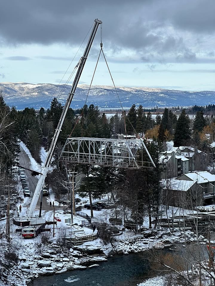 Bridge Street Bridge’s iconic truss is removed by crane Thursday, Jan. 2. (Courtesy/Kyle Koehler)