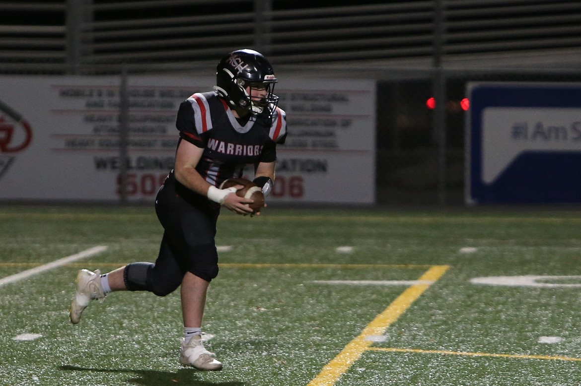 Almira/Coulee-Hartline senior Carter Pitts returns an intercepted pass during a game against Inchelium in the 1B State Football Tournament. Pitts was named the 1B Defensive Player of the Year by the Washington State Football Coaches Association.