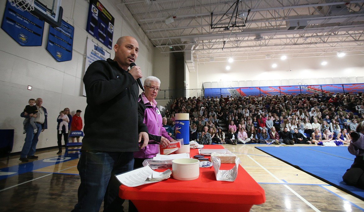 Justin and Betty Capaul address Coeur d'Alene High School students Tuesday after opening a time capsule created by members of the Class of 1950 during their 50th class reunion in 2000. Justin's grandfather, Ray, was the 1950 student body president. Written instructions taped to the capsule said Justin, a 2000 grad, was to open it this year.