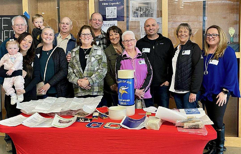 Relatives of 1950 Coeur d'Alene High School Class President Ray Capaul, who passed away in 2017, gather Tuesday as a time capsule created by his class is opened during a special ceremony. Front row, ladies, from left: Heidi Capaul holding Dempson Capaul, Toni Capaul, Kathy Capaul, Dorothy Capaul-Ladewig, Betty Capaul, Diana Capaul-Guild and RaeAnne Capaul. Back row, gentlemen, from left: Mark Ladewig, Ken Capaul holding Porter Capaul, Bob Capaul and Justin Capaul.