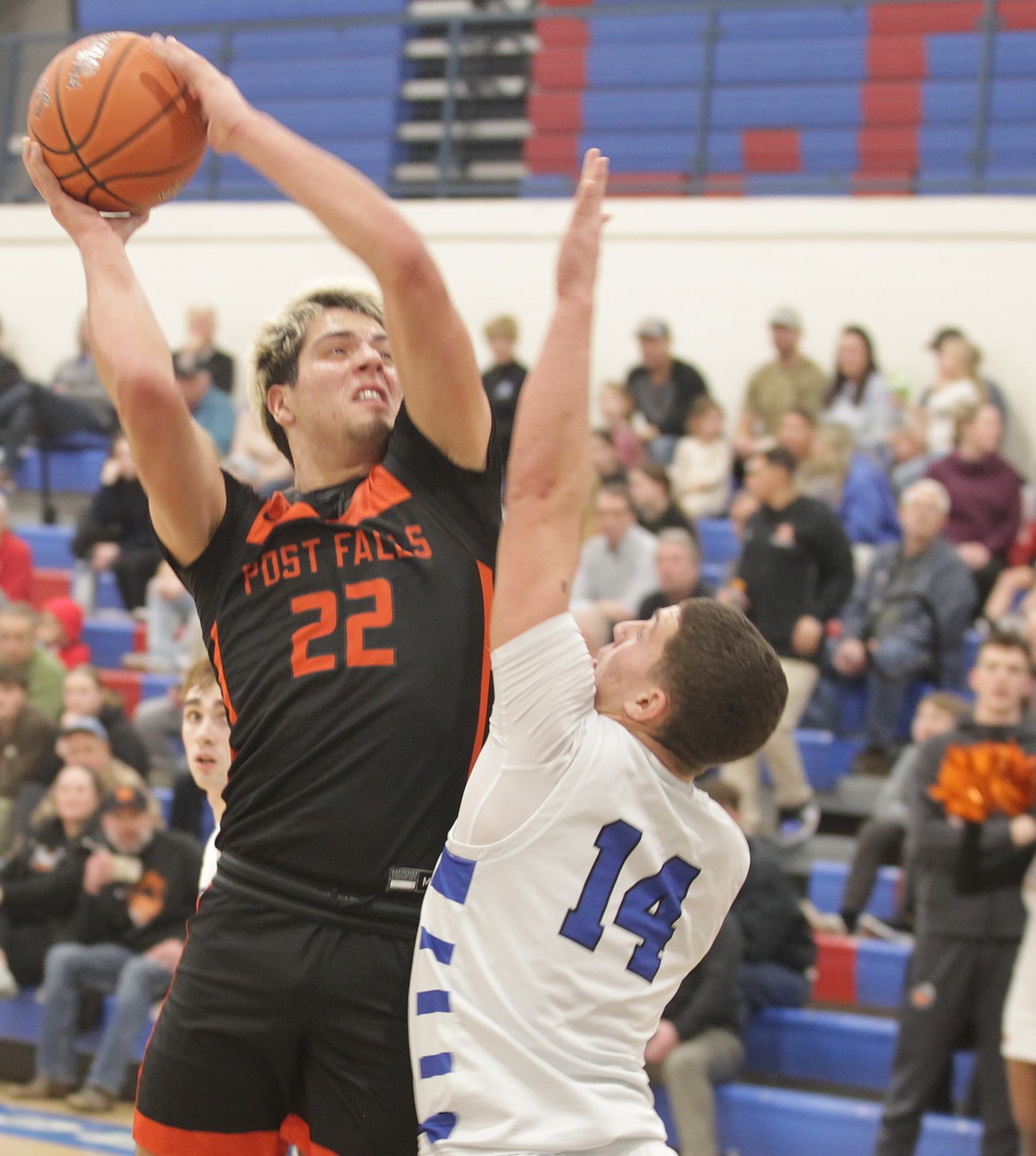 JASON ELLIOTT/Press
Post Falls forward Tyras Blake shoots over the defense of Coeur d'Alene's Kai Wheeler during the first quarter of Tuesday's game at Viking Court.