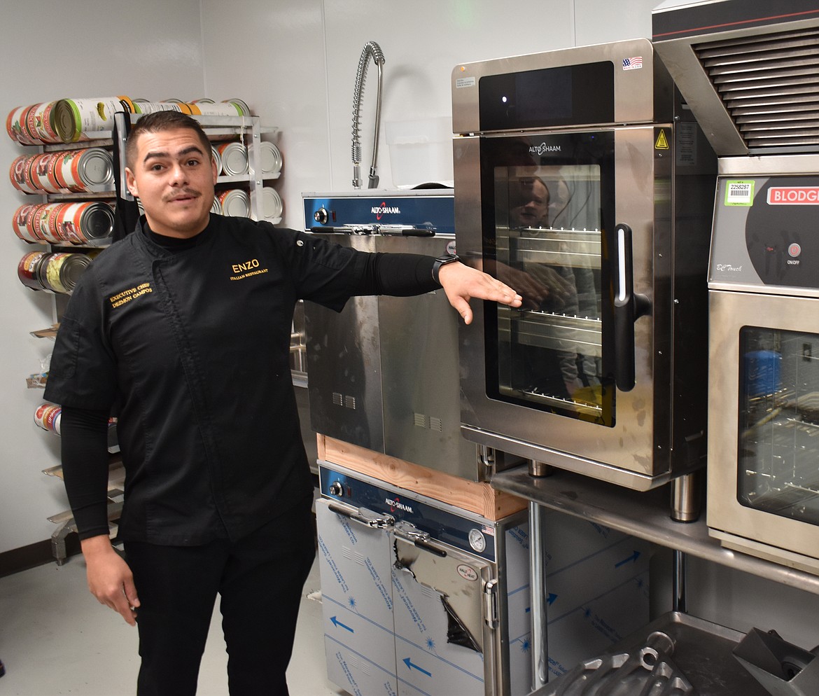 ENZO Executive Chef Dez Campos shows off some of the equipment in his expanded kitchen.