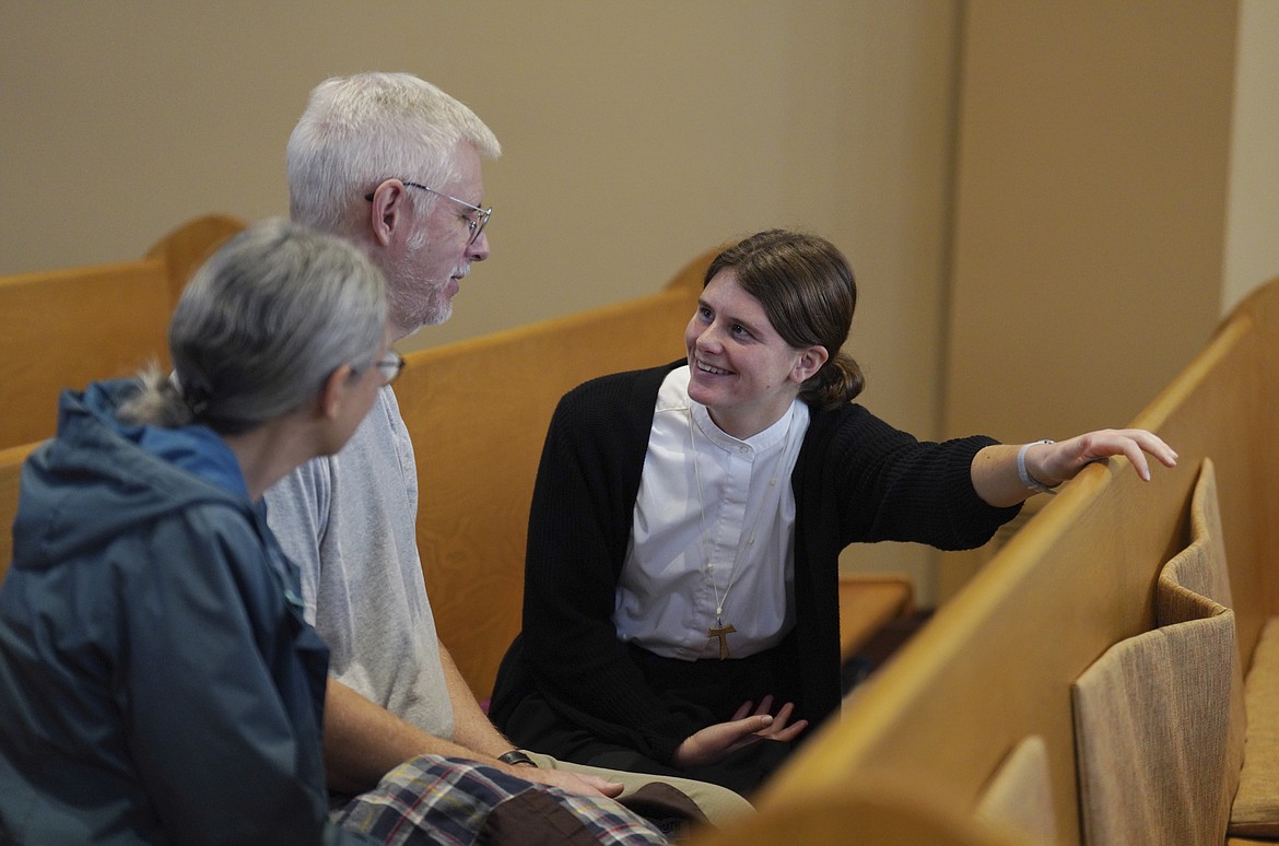 Zoey Stapleton, right, a postulant with the Franciscan Sisters T.O.R., of Penance of the Sorrowful Mother, talks with her parents who are visiting from Pennsylvania after Mass in the chapel of the mother house in Toronto, Ohio, in November 2024.