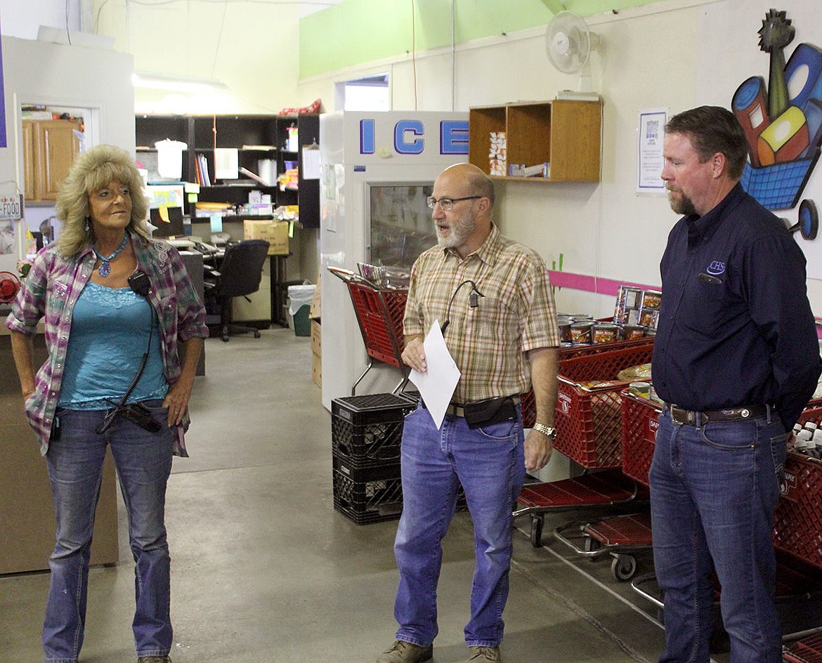 State Sen. Judy Warnick said Peny Archer, left, and her staff made the old food bank on Marina Drive work, even though it was a less-than-ideal location. Peny is pictured at the old facility with former Financial Manager Scott Kilpatrick, center, and a representative from CHS Sun Basin in 2016.