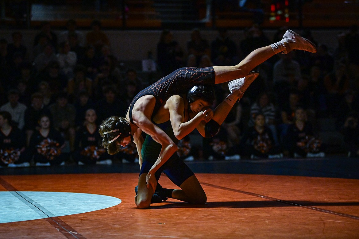 Glacier's Aiden Sweat wrestles Flathead's Dayton Naldrett at 110 pounds at Flathead High School on Thursday, Jan. 9. (Casey Kreider/Daily Inter Lake)