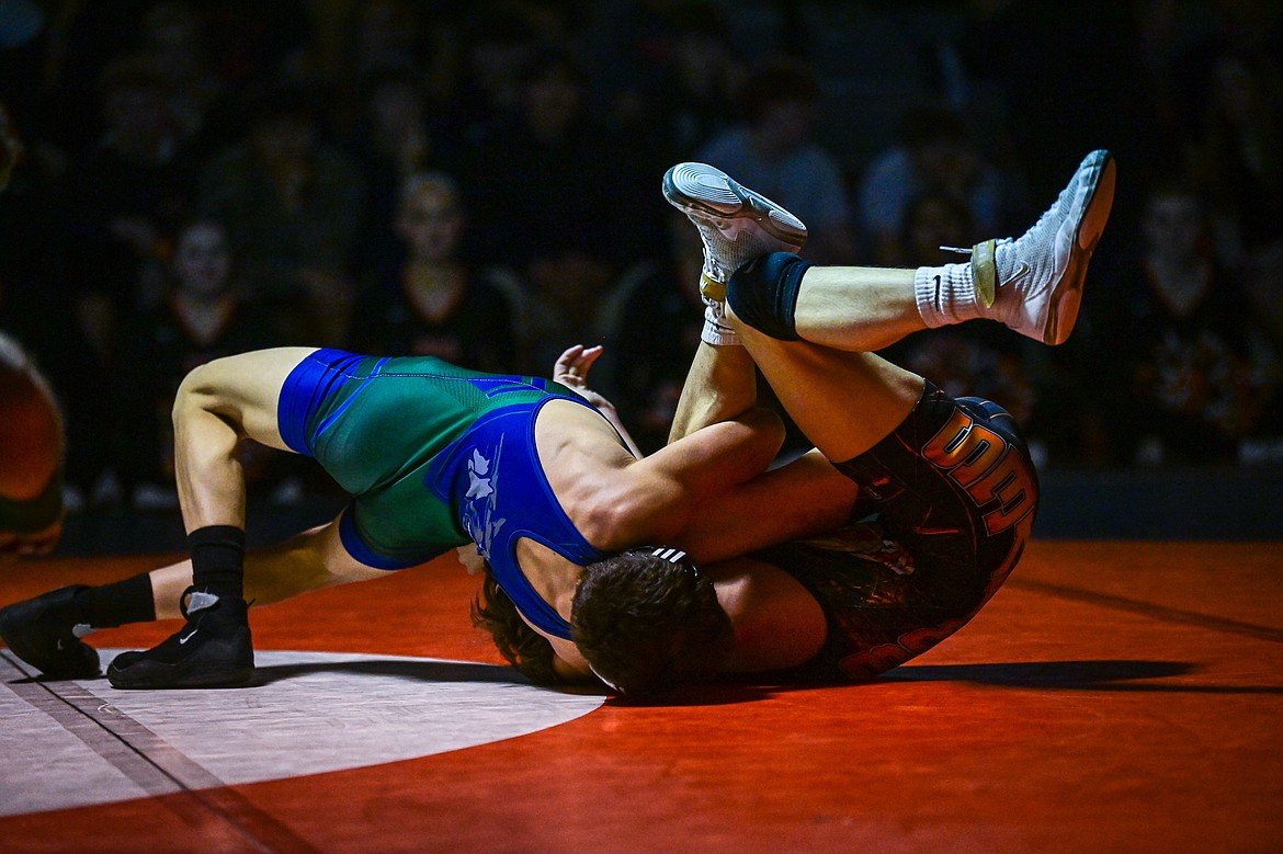 Glacier's Aiden Sweat wrestles Flathead's Dayton Naldrett at 110 pounds at Flathead High School on Thursday, Jan. 9. (Casey Kreider/Daily Inter Lake)