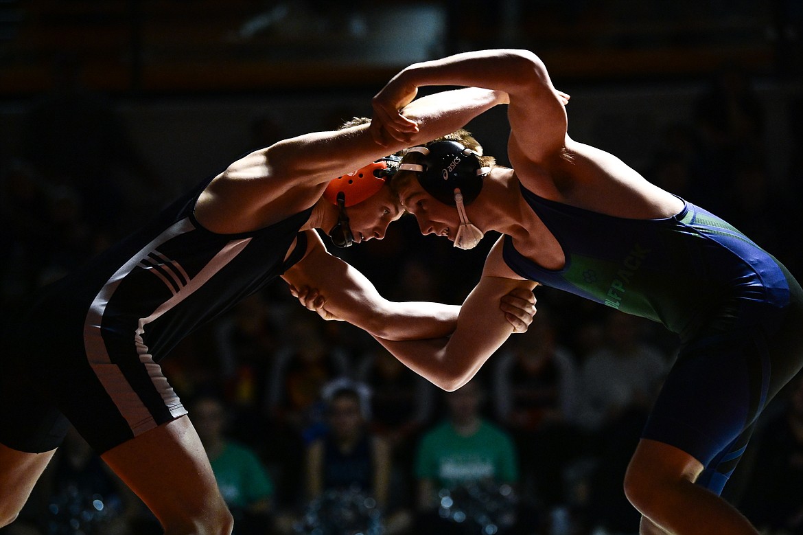 Flathead's Dane Lake and Glacier's Sylas Chapman tie up at 157 pounds at Flathead High School on Thursday, Jan. 9. (Casey Kreider/Daily Inter Lake)