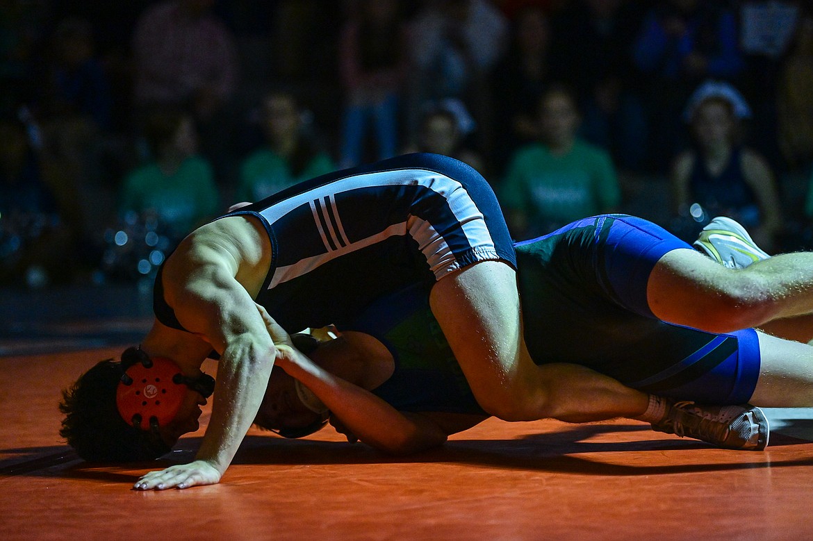 Flathead's Dane Lake works toward a pin of Glacier's Sylas Chapman at 157 pounds at Flathead High School on Thursday, Jan. 9. (Casey Kreider/Daily Inter Lake)