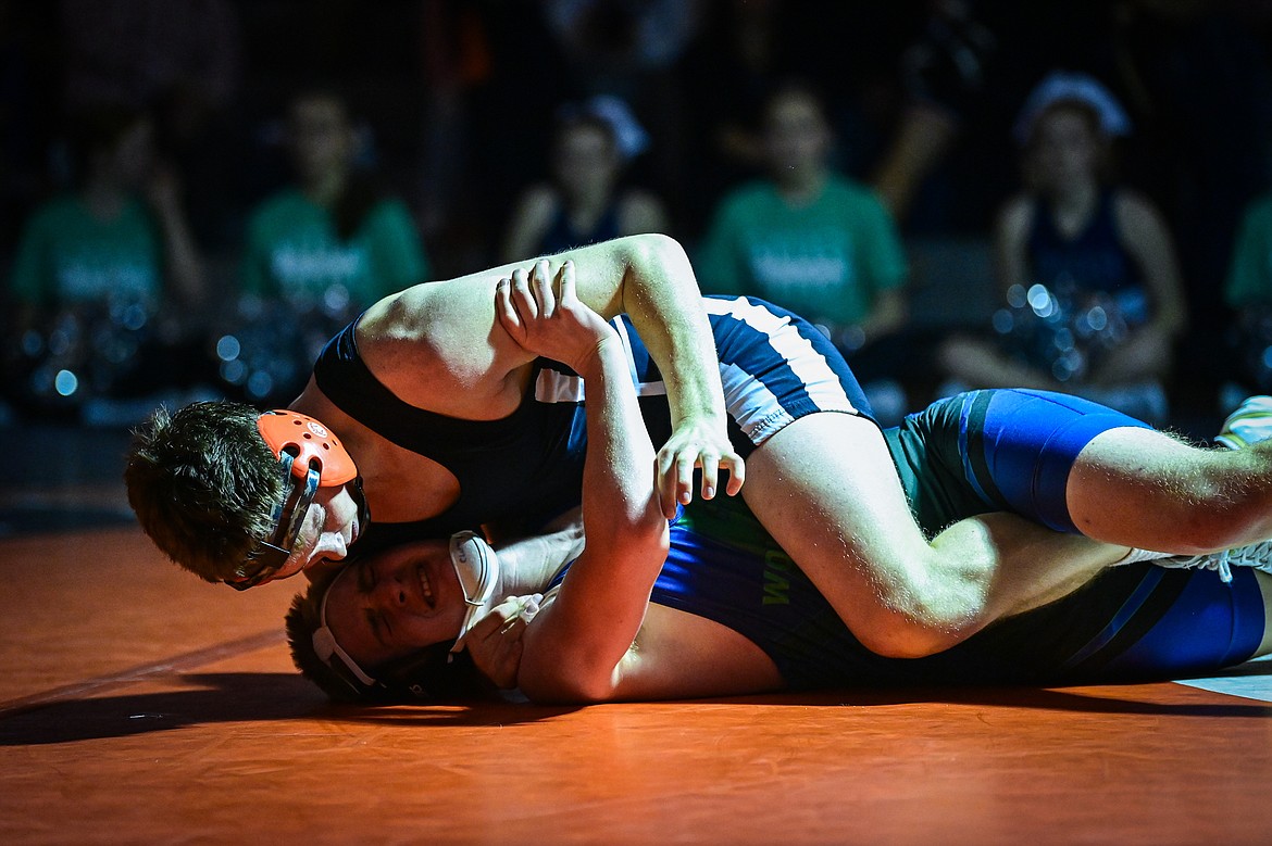 Flathead's Dane Lake works toward a pin of Glacier's Sylas Chapman at 157 pounds at Flathead High School on Thursday, Jan. 9. (Casey Kreider/Daily Inter Lake)