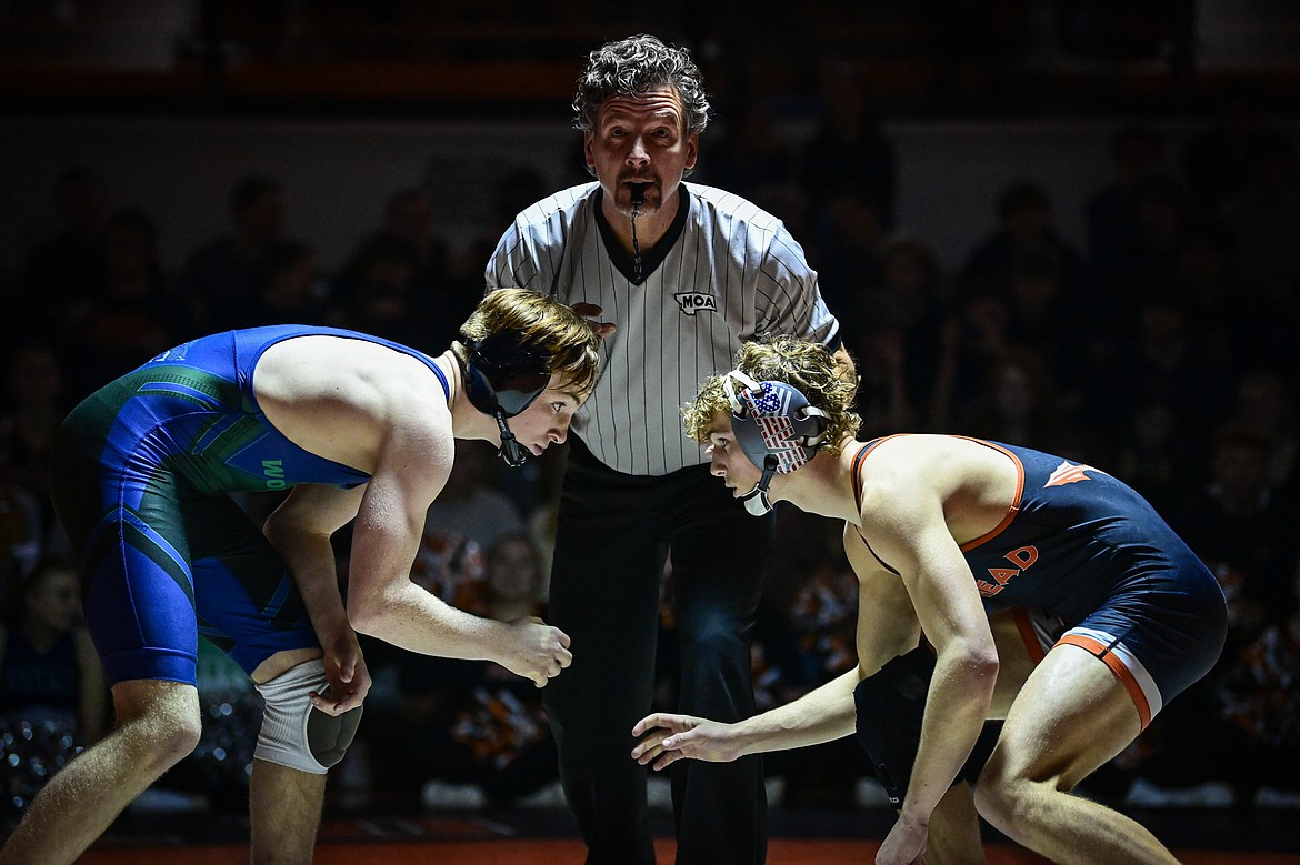 Glacier's Jerin Coles and Flathead's Brett Chivers square off at 150 pounds at Flathead High School on Thursday, Jan. 9. (Casey Kreider/Daily Inter Lake)