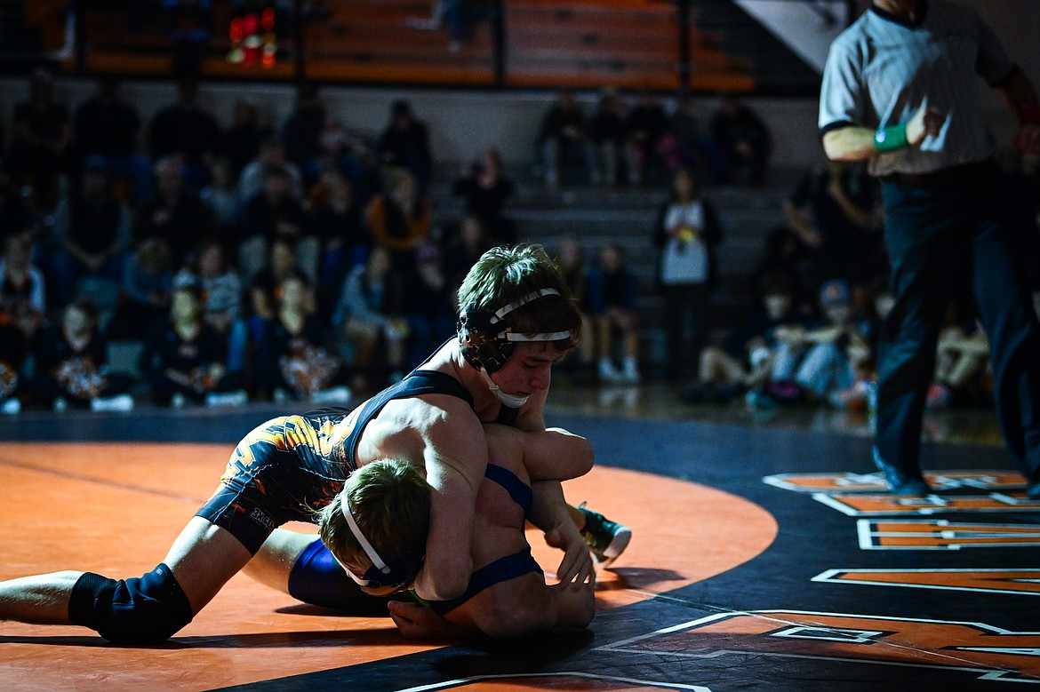 Flathead's Daniel Evert wrestles Glacier's Dillon Sams at 138 pounds at Flathead High School on Thursday, Jan. 9. (Casey Kreider/Daily Inter Lake)