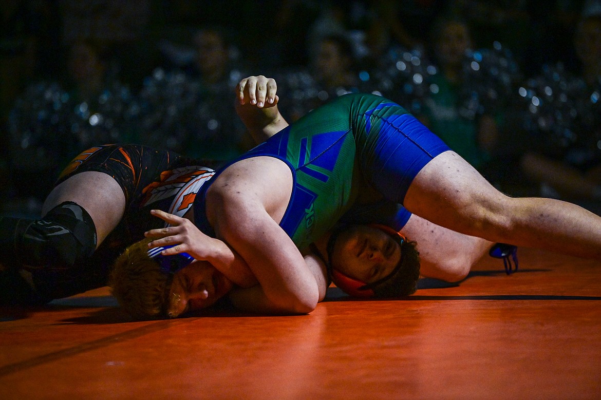 Glacier's Noah Horn works toward a pin of Flathead's Blane Olsen at 285 pounds at Flathead High School on Thursday, Jan. 9. (Casey Kreider/Daily Inter Lake)